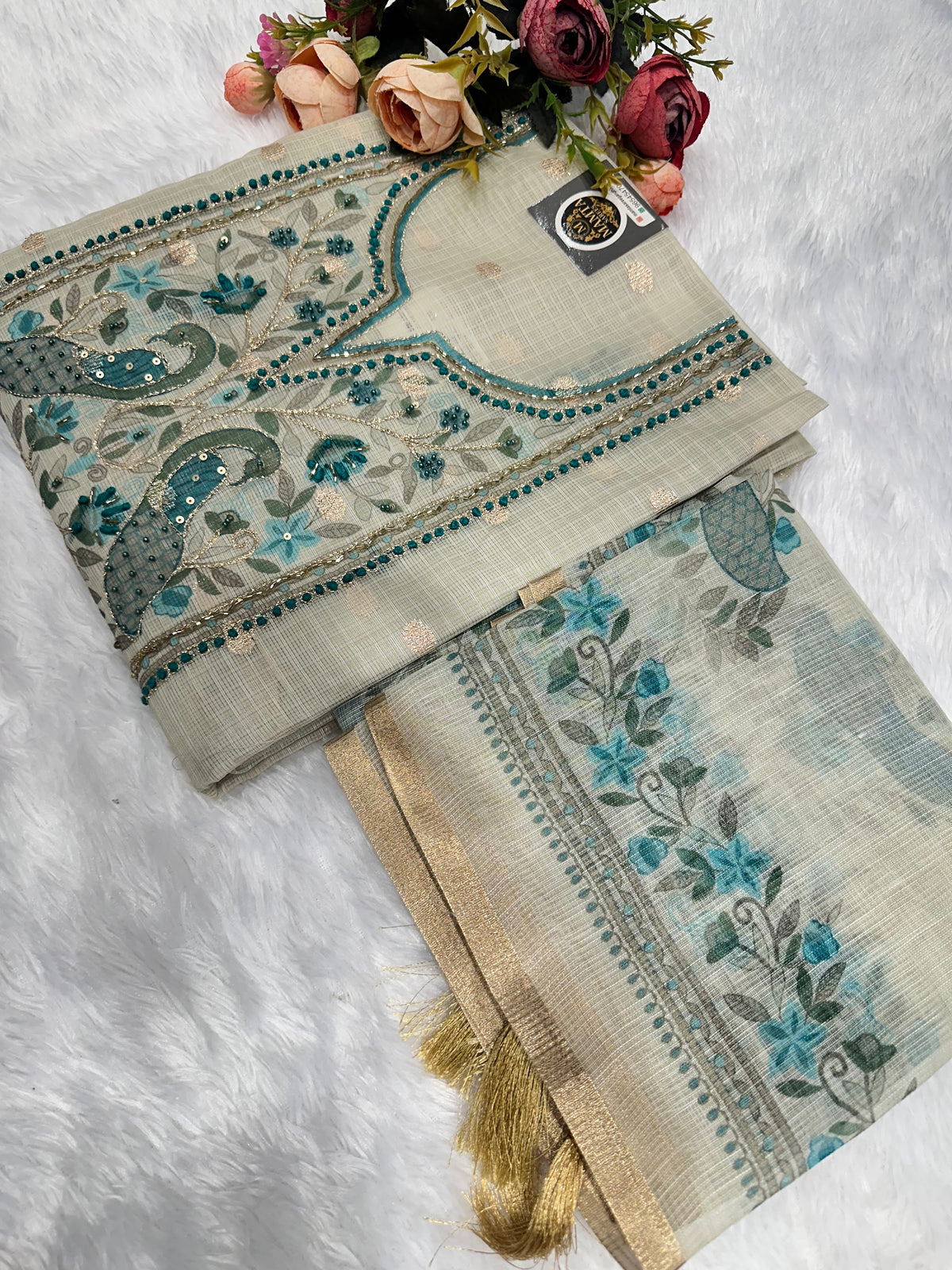 Ivory peacock embroidered suit by Mamta Saree - teal thread embroidery close-up