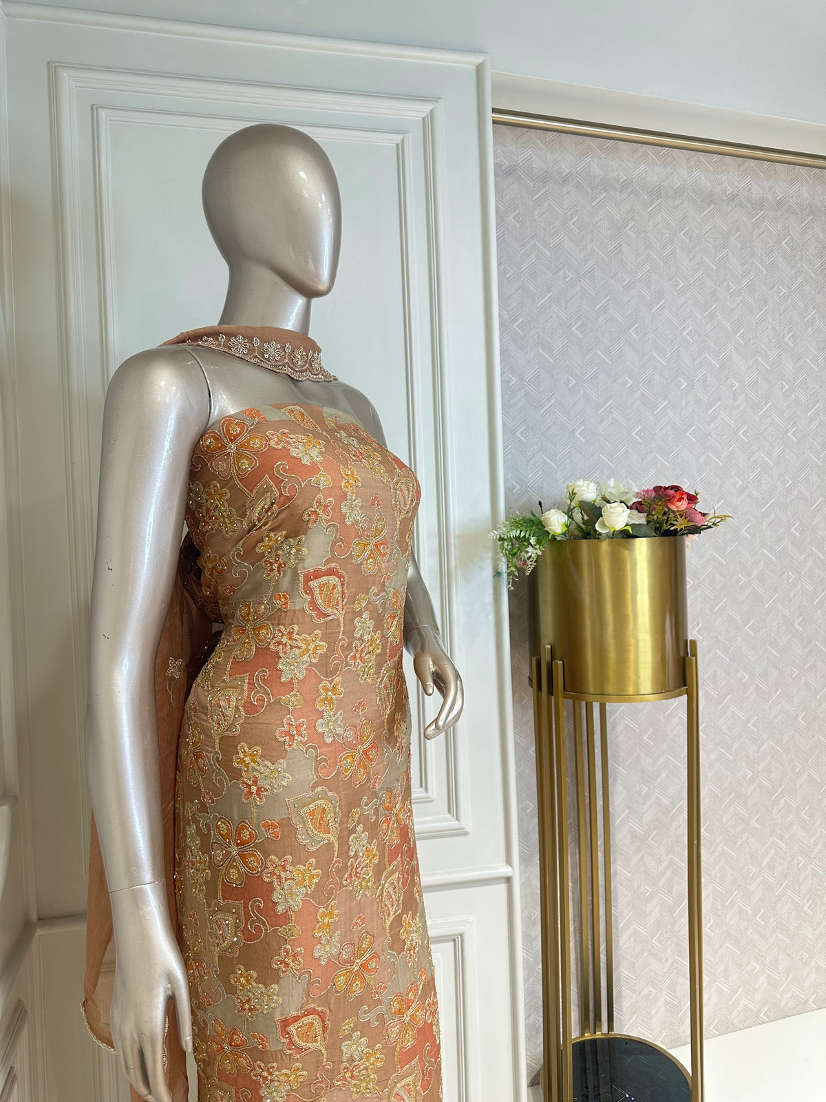 Peach suit set by Mamta Saree - close-up of floral print and beaded border