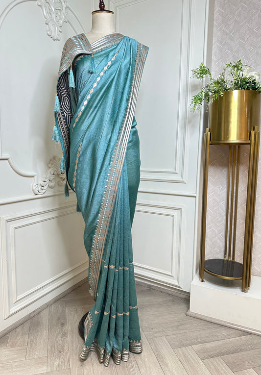 Aqua Blue Designer Saree with Zari Woven Border & Tassels